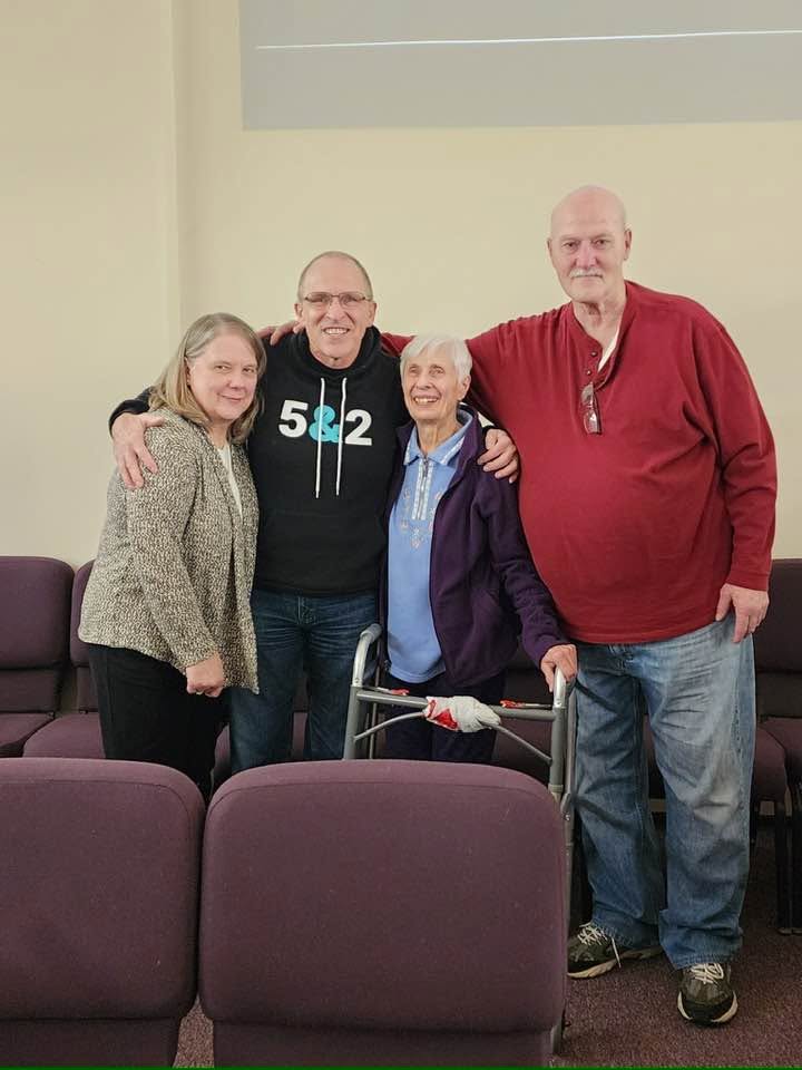 Church members arm in arm after a gathering